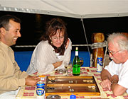 Captain Mehmet (left) loves backgammon